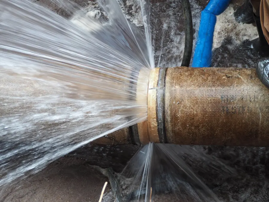 Burst pipe spraying water in a Maple Grove, MN home
