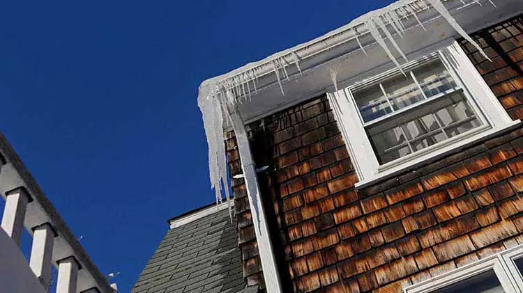 Ice dam and icicles on a Maple Grove, MN roof