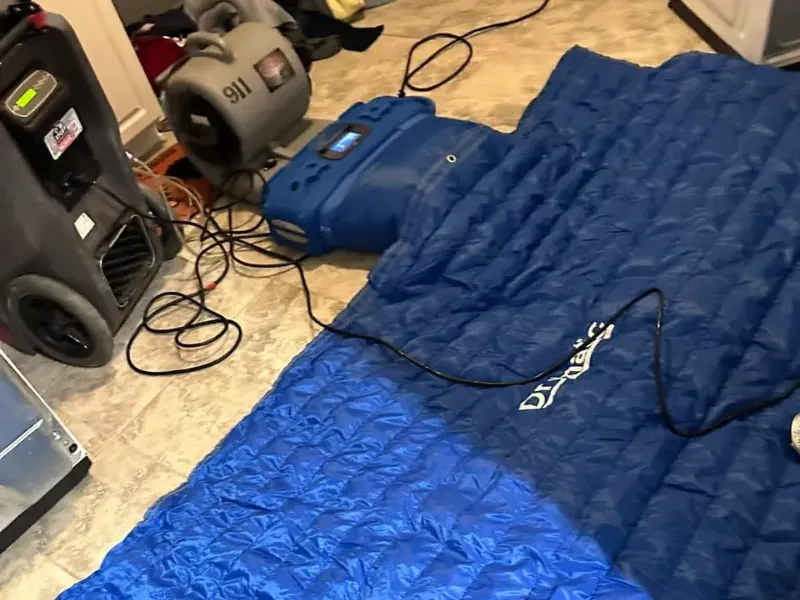 Air movers drying a water-damaged Maple Grove, MN floor